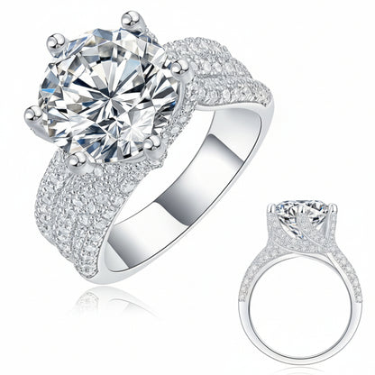 Silver ring with large diamond and smaller diamond on a white background